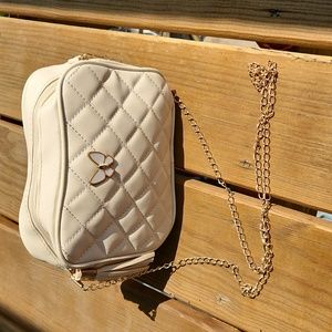 A crossbody purse with butterfly